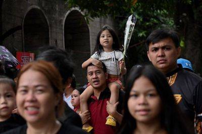 Filipinos throng cemeteries for All Saints' Day