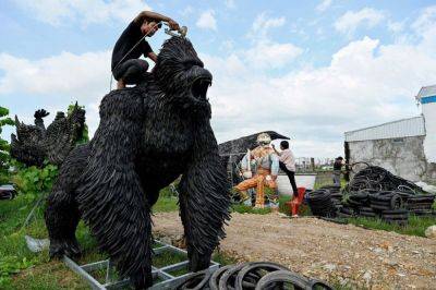 Cambodian artist turns tires into giant King Kong