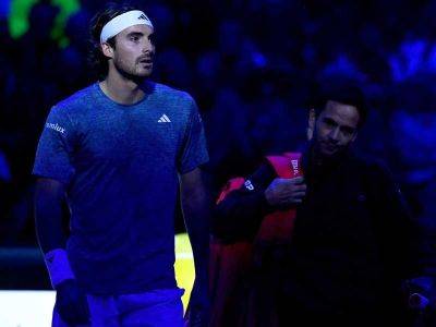 Tsitsipas quits ATP Finals with back injury