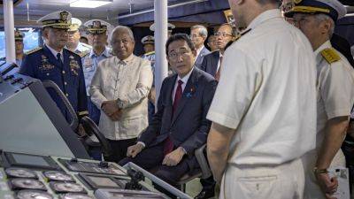 Japan's prime minister tours Philippine patrol ship and boosts alliances amid maritime tensions