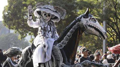 See photos of Mexico City’s Day of the Dead parade