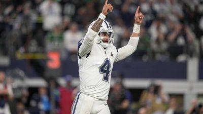 Cowboys pull even with Eagles in NFC East with 33-13 victory