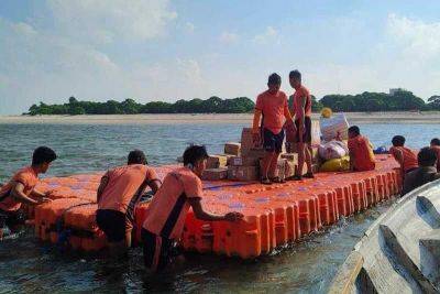 Gift-bearing boat reaches Lawak Island — Christmas convoy organizer