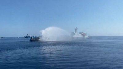 China fires water cannon on Philippines humanitarian ships