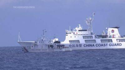 Philippines - Tense face-off: Philippines confronts China over sea claims - apnews.com - Philippines - Britain - China -  Beijing