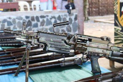 Folks in Basilan's port city surrender rifles, machinegun
