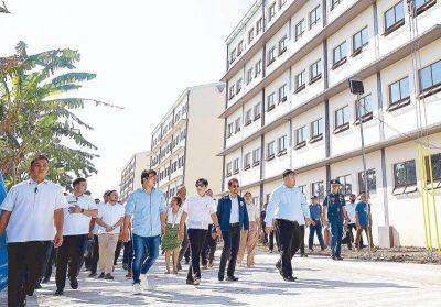 Marcos turns over Bacoor housing units to relocated residents