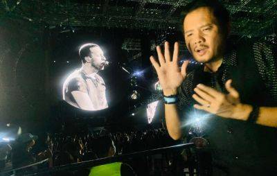 Sign language interpreter signs for deaf fans at Coldplay's Manila concert