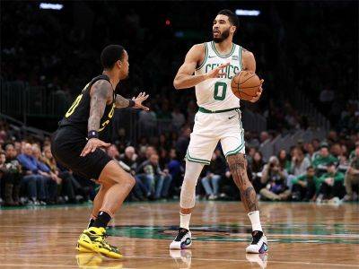 Celtics crush Jazz to remain unbeaten at home
