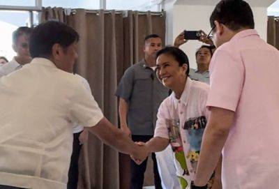 Marcos, Robredo meet, shake hands in another arena