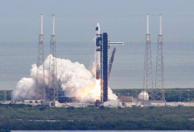 SpaceX docks at ISS to take stranded astronauts home next year