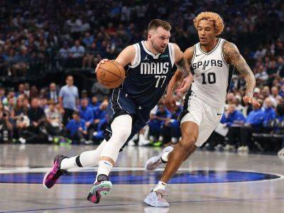 Doncic flirts with triple-double as Mavs pry off Spurs