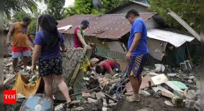 At least 115 dead and missing in massive flooding and landslides in Philippines