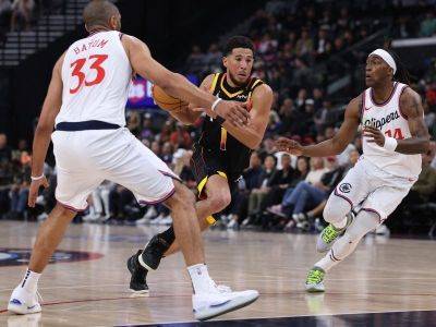 Booker scores 40 as Suns storm back to beat Clippers