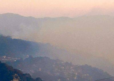 Public warned vs smog caused by forest, bush fires in Baguio, Benguet