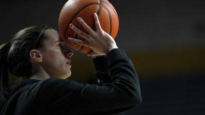 Basketball - Caitlin Clark - Caitlin Clark's 33-point game moves her past Lynette Woodard for the major college scoring record - apnews.com - state Minnesota - state Iowa - state Kansas - city Minneapolis