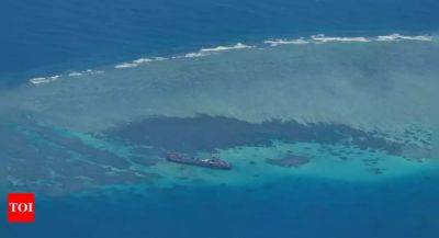China says Philippine vessel 'illegally' landed on disputed atoll
