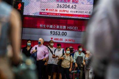 Most Asian markets fall after strong US data, eyes on inflation