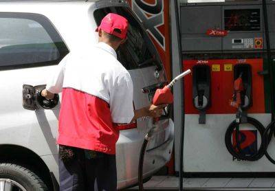 Oil firms lower pump prices
