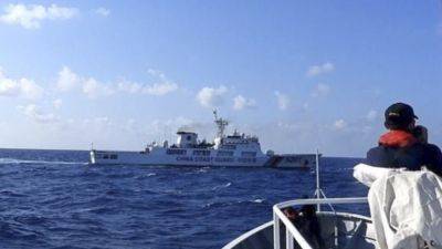JIM GOMEZ - Jay Tarriela - Chinese coast guard ships attempt to block Philippine vessels carrying scientists in South China Sea - apnews.com - Philippines - Usa - Malaysia - Vietnam - China - Taiwan - Washington - Brunei - city Beijing - city Manila, Philippines