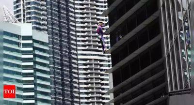 South China Sea: French ‘spider-man’ climbs Manila high-rise in solidarity with Philippines