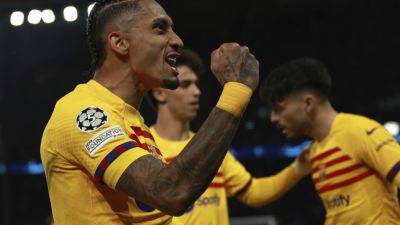 Raphinha scores twice as Barcelona beats PSG 3-2 in 1st leg of Champions League quarterfinals - apnews.com - Spain - Brazil