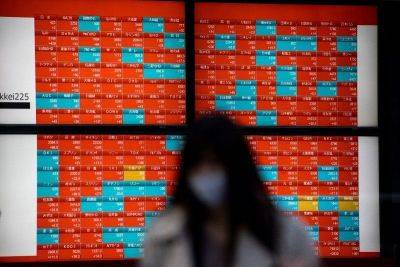 Asian stocks sink despite to track Wall St gains, earnings in focus
