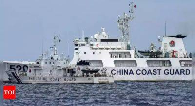 Philippines says China Coast Guard fired water cannon at its vessels - timesofindia.indiatimes.com - Philippines - China - county Island - city Beijing - city Manila - city New Delhi