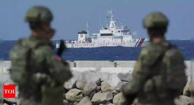 Philippines sends ships to disputed atoll where China building 'artificial island'
