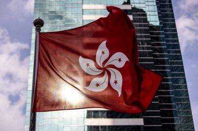 HK cancels passports of six activists