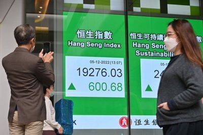 Asian stocks build on Wall St records after US inflation data