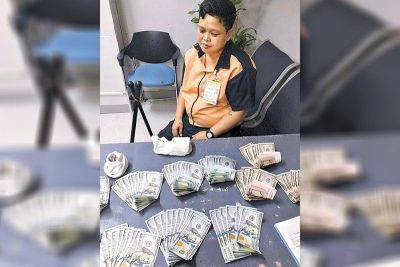 Cleaner finds P1 million hidden in used socks at NAIA