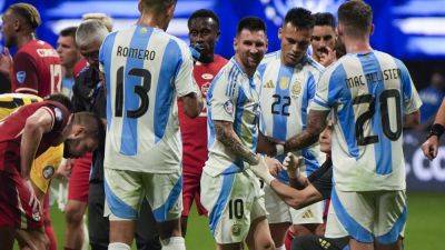 Messi and Argentina overcome Canada and poor surface, start Copa America title defense with 2-0 win