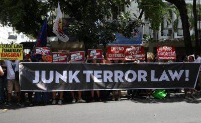 Rights groups rally at DoJ to mark 4th anniversary of Anti-Terrorism Act signing