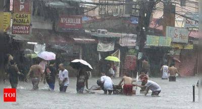 Taiwan prepares for a strong typhoon that worsened monsoon rains in the Philippines, killing 13 - timesofindia.indiatimes.com - Philippines - Taiwan - province Batangas - city Taipei - city Manila - city Marikina
