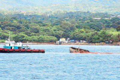 Sunken motor tanker partially afloat – PCG