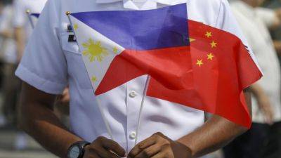 China and the Philippines announce deal aimed at stopping clashes at fiercely disputed shoal