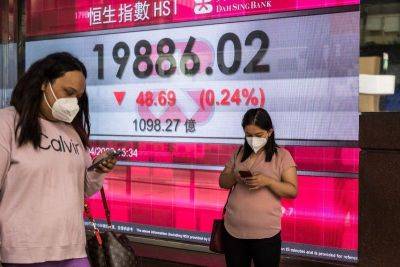 Asia tracks Wall St lower as traders pause Fed-fuelled rally