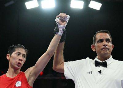 Taiwan boxer in Olympics gender row wins as controversy rages