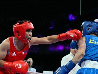 Petecio outpoints Chinese foe, guarantees another Olympic medal for Philippines