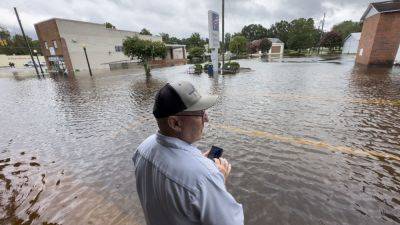 Debby bringing heavy rain, flooding and possible tornadoes northeast into the weekend