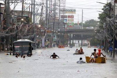 MMDA bans swimming in floods for fun