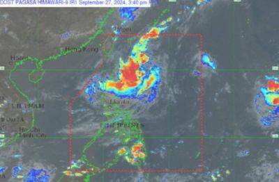 Tropical Depression Julian nearly stationary over PH Sea