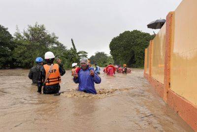 Typhoon lashes northern Philippine islands, flooding coastal villages